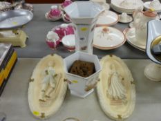 Two pottery planters and a pair of composite wall plaques