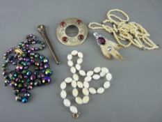 White metal and furred claw brooch with oval precious stone, two other Celtic type brooches, one