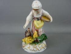 Dresden porcelain figurine of a young girl feeding chickens