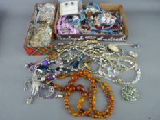 Quantity of costume jewellery, necklaces etc including a double strand of amber type beads