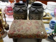Vintage footstool and a pair of black pottery vases decorated with African scenes