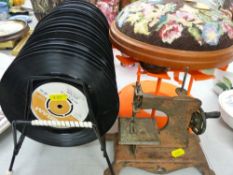 Vintage record rack and contents, tapestry top footstool, toy sewing machine etc