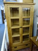 Modern oak twin door glazed display cabinet with lower single drawer