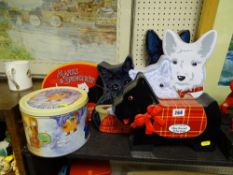 Parcel of four shortbread tins in the form of dogs and two others