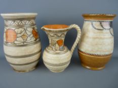 Two Crown Ducal vases and a jug, tube line decorated in Frederick/Charlotte Rhead style