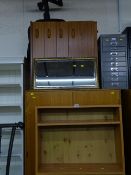 Modern slim three shelf bookcase, chest of drawers and a black office swivel chair