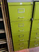 Olive green metal four drawer filing cabinet