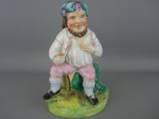 Early Staffs model of a jolly wine drinking gent seated upon a barrel