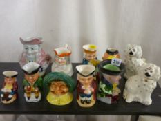 Pair of Beswick pottery comforter dogs with a collection of vintage style pottery character and Toby