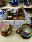 Large parcel of copper lustre jugs including two large jugs