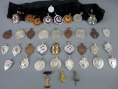 Large parcel of mainly white metal (plus three silver) trophy pendants (approximately twenty five)