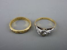 Two eighteen carat gold rings, one with cz solitaire and the other with tiny pearl decoration, 4