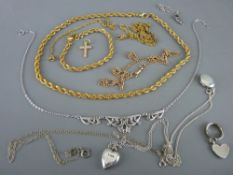 Parcel of yellow metal and silver chains and with two silver lockets, one oval and one heart shaped