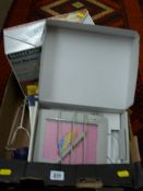 Boxed foot warmer, blood pressure arm monitor and a boxed UC Logic Superpen