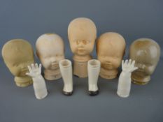 Group of vintage pottery doll's heads and limbs