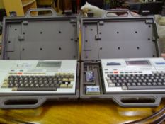 Two cased Epson HX20 personal office systems