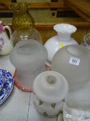Collection of vintage glass light and lampshades including an etched example with a cranberry colour