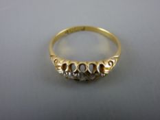 Lady's eighteen carat gold dress ring with five small diamonds, 2.6 grms