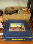 Boxed Hornby clockwork train set, a loose quantity of same with a selection of model buildings etc