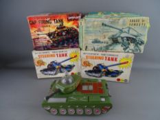 FOUR VINTAGE BATTERY OPERATED TANKS including a Marx HK-8194 cap firing tank, two HK-6402 remote