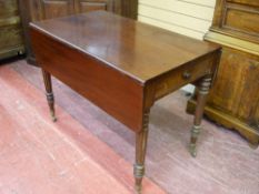 A REGENCY MAHOGANY TWIN FLAP PEMBROKE TABLE with single end drawer, on turned and fluted supports