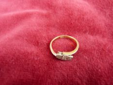 AN EIGHTEEN CARAT GOLD THREE-STONE DIAMOND RING each in a square setting, visual estimate 0.8