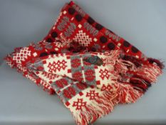A VINTAGE WELSH WOOLLEN BLANKET with 'Derw Product' label, traditionally patterned in block form