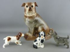 FOUR POTTERY DOG FIGURINES including a large seated pug with glass eyes, a Beswick spaniel, a Goebel