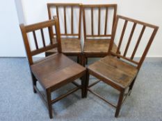 A MATCHING SET OF THREE, PLUS ONE OTHER, ANTIQUE OAK FARMHOUSE CHAIRS
