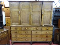 A SUBSTANTIAL EARLY 19th CENTURY OAK HOUSEKEEPER'S CUPBOARD having four top cupboard doors,