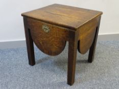 A VINTAGE OAK BOX SEAT STOOL with shaped apron, 47.5 cms high, 47.25 cms wide, 41 cms deep