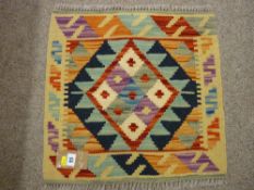 A NEAT VEGETABLE DYE WOOL SHOBI KILIM RUG, multi-coloured single central spreading diamond
