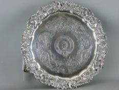 A GEORGE IV SILVER CIRCULAR THREE FOOTED TRAY, London 1825, maker Joseph Cradock, having a pierced