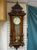 A GOOD WALNUT CASED VIENNA TWIN WEIGHT PENDULUM WALL CLOCK, 136 x 42 cms