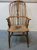 A 19th CENTURY STICKBACK WINDSOR ARMCHAIR, 110 cms high, 53 cms wide, 38 cms seat depth