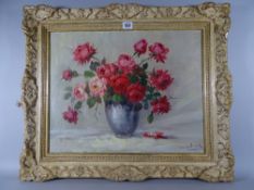 CONTINENTAL SCHOOL oil on canvas - still life, red roses in a vase, indistinctly signed, 39 x 49