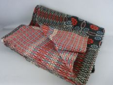 A TRADITIONAL WELSH WOOLLEN BLANKET in black and red repeating patterns, 188 x 220 cms