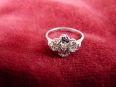 A FINE QUALITY EIGHTEEN CARAT WHITE GOLD & PLATINUM FOUR STONE DIAMOND DRESS RING, visual estimate