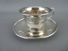 A SILVER CUP & SAUCER, Birmingham 1932, 2.1 troy ozs, 5 cms high combined (monogrammed O F S, cup