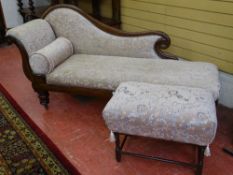 A VICTORIAN MAHOGANY CHAISE LONGUE and a rectangular footstool, both re-upholstered in matching