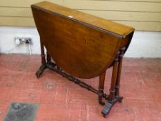 A SLIM VICTORIAN MAHOGANY SUTHERLAND TABLE, twin flap with turned supports and stretcher on brass