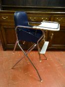 A VINTAGE MOTHERCARE CHROME & FORMICA CHILD'S HIGHCHAIR with blue rexine seating, 90 cms high, 44