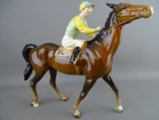 A BESWICK RACE HORSE & JOCKEY (walking race horse), model no. 1037, 21 cms high, green and yellow