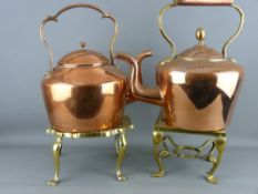 TWO 19th CENTURY COPPER KETTLES on brass trivet stands