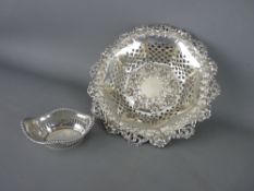 A CIRCULAR SILVER PIERCED BOWL with scroll & leaf border and with pierced & floral base & edging,