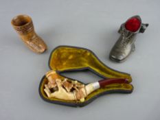 A CASED MEERSCHAUM PIPE carved in the form of a hand holding an oak leaf branch with amber