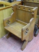 A VICTORIAN OAK SINGLE CHURCH/CHAPEL PEW with slight Gothic detail, 97 cms high, 66 cms wide, 46 cms