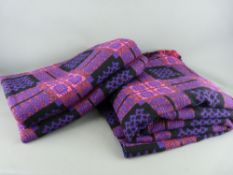 AN EXCELLENT PAIR OF VINTAGE WELSH WOOLLEN BLANKETS, traditional patterns in purple and pink tones