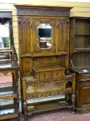AN EXCELLENT JACOBEAN STYLE OAK MIRRORED HALLSTAND with carved and pierced rail detail, single