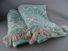 A LARGE TRADITIONAL WELSH WOOLLEN BLANKET with 'Trefriw Mills' label, traditional patterns on pink